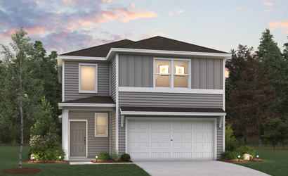 A house with a garage and trees.