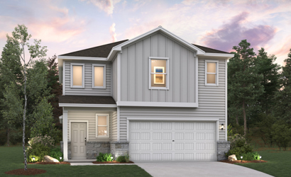 A house with a garage and trees around it.