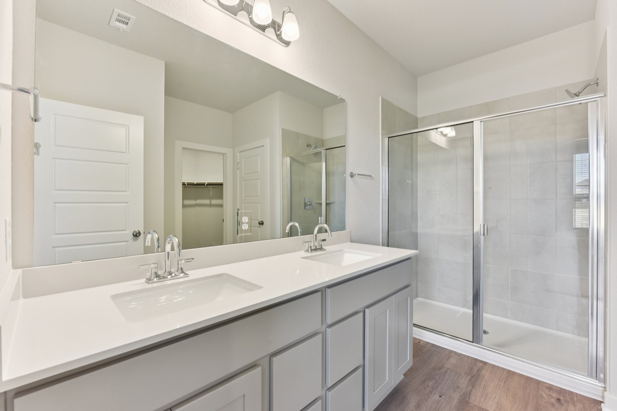 A bathroom with a glass shower.