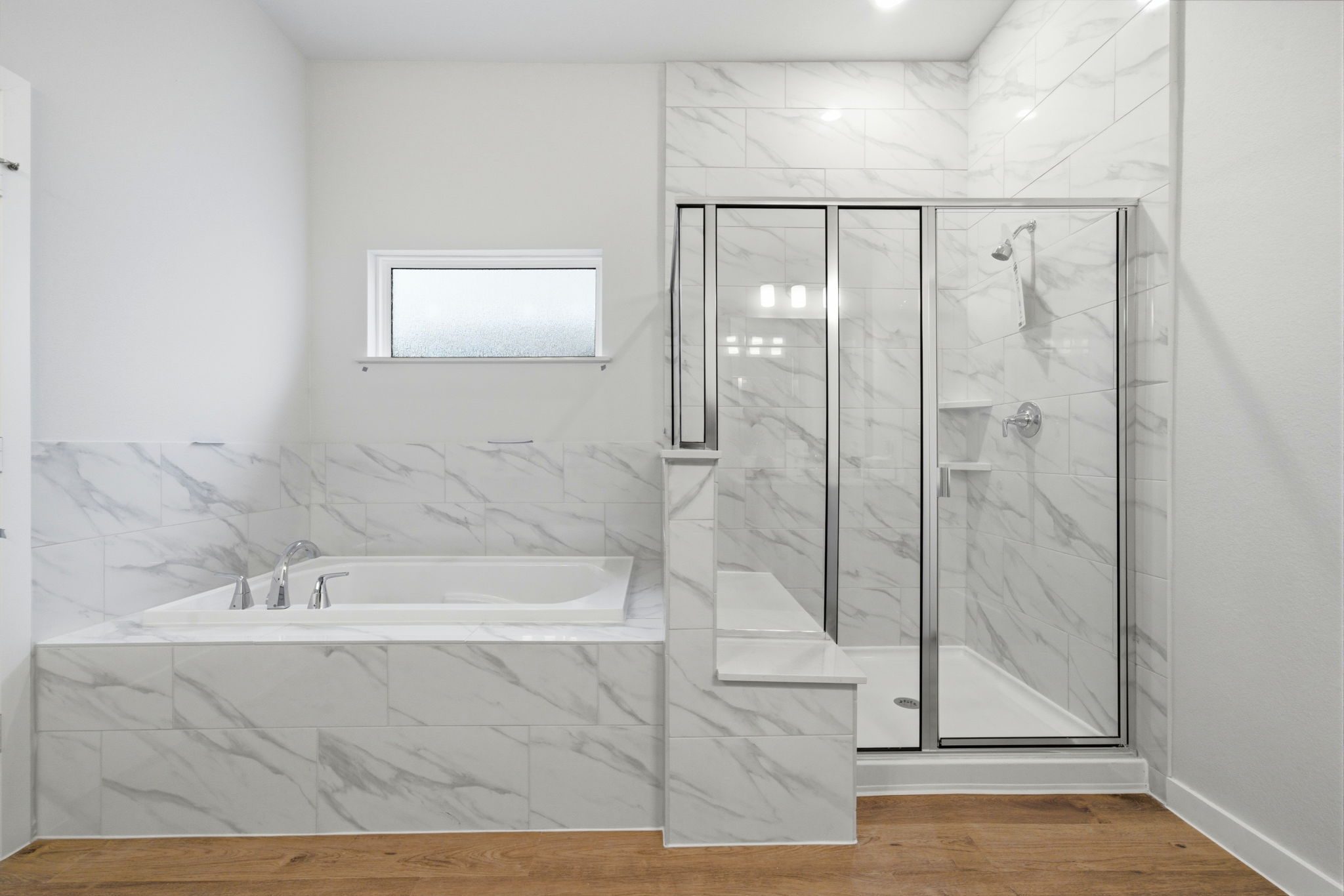 A bathroom with a glass shower.