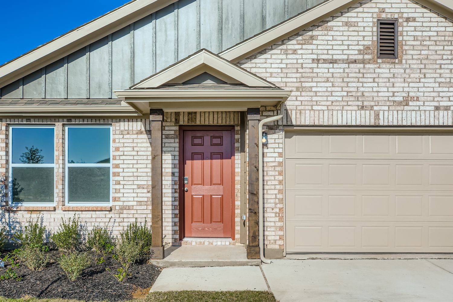 A house with a garage door.