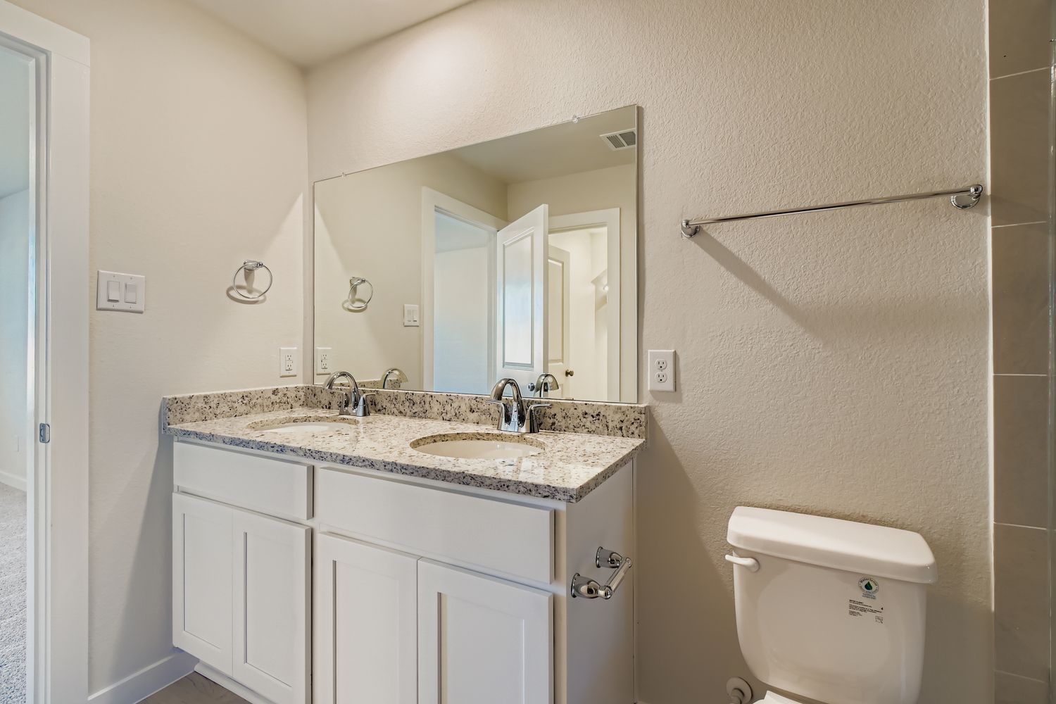 A bathroom with a sink and a toilet.