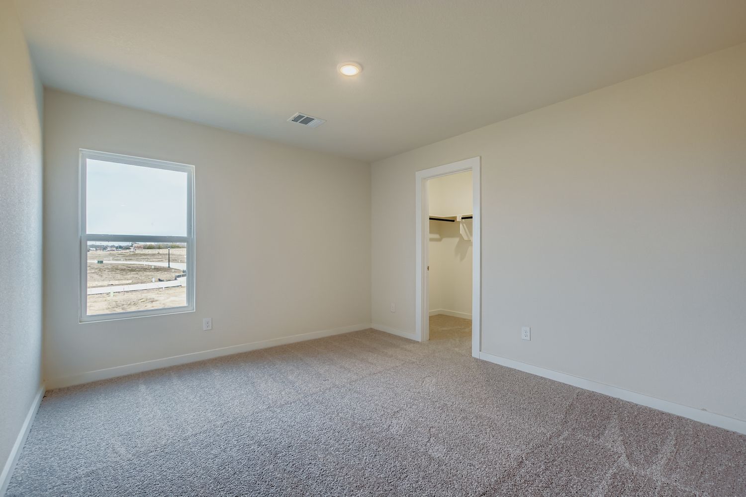 A room with a window and a door.