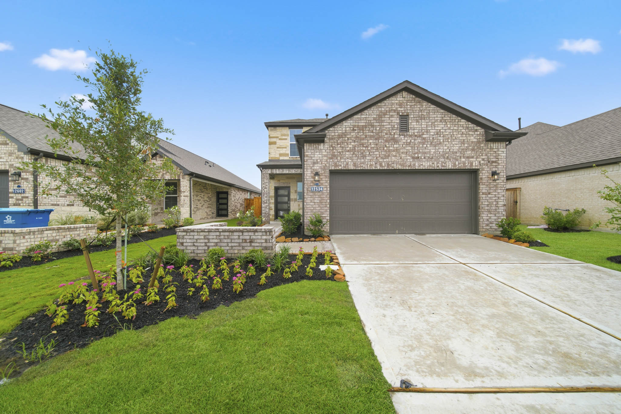 A driveway leading to a house.