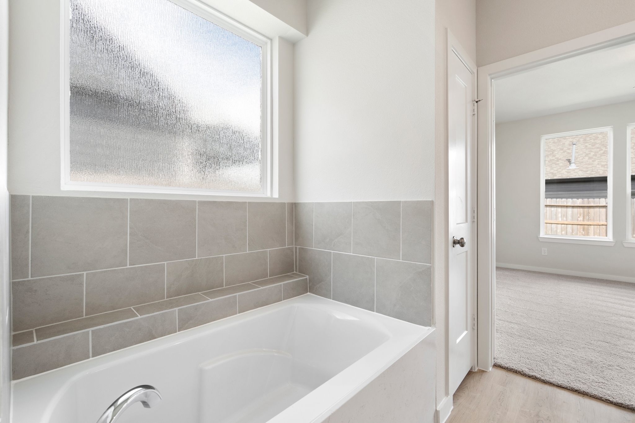 A bathtub in a bathroom.