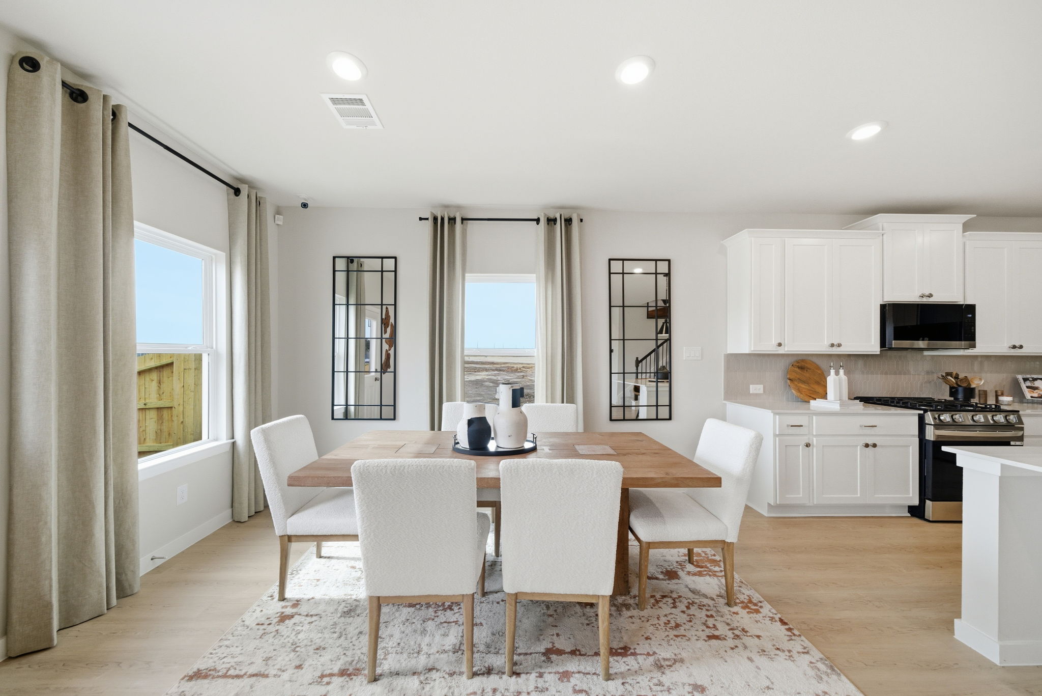 A kitchen with a dining table.