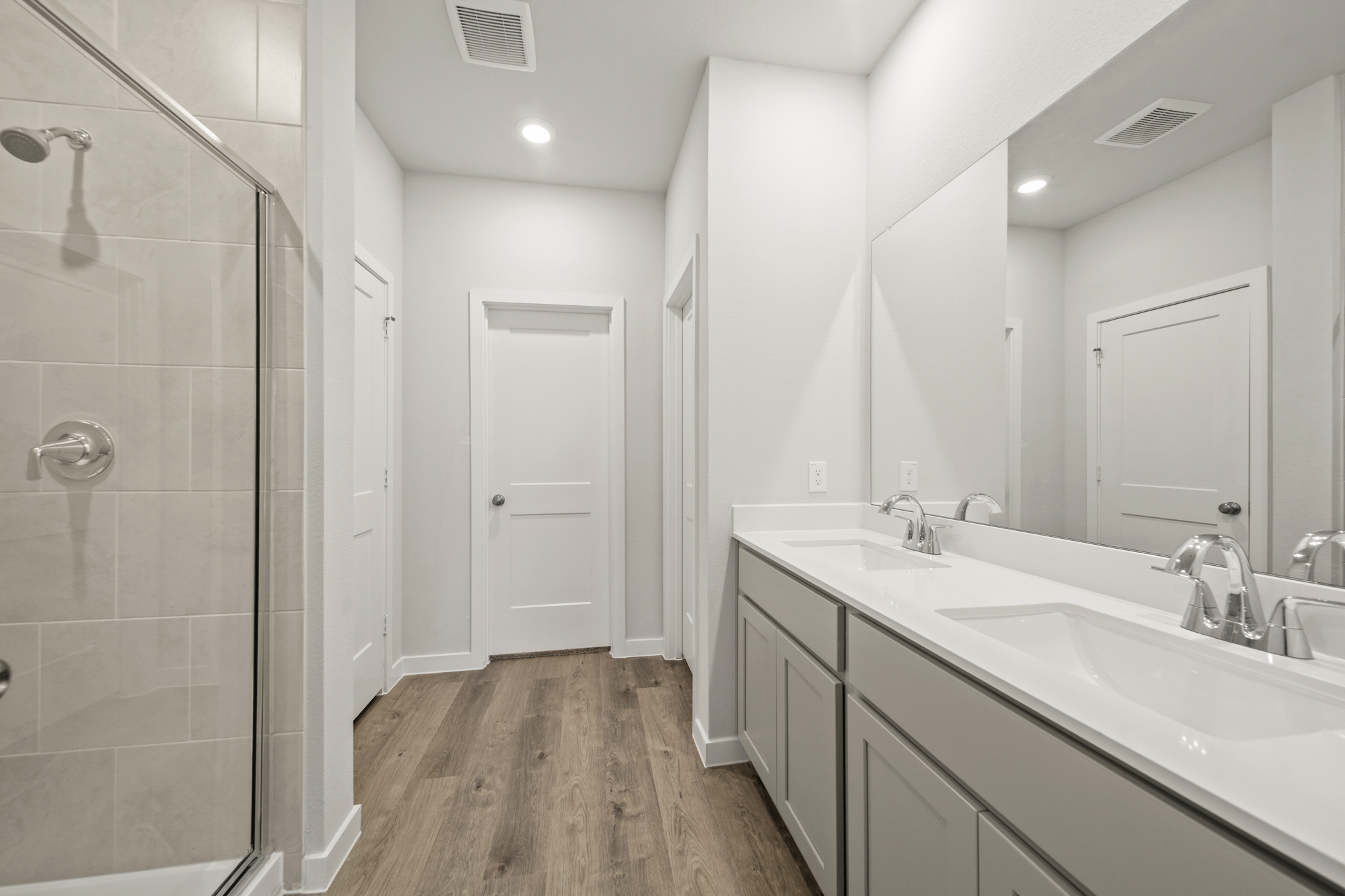 A bathroom with a glass shower.