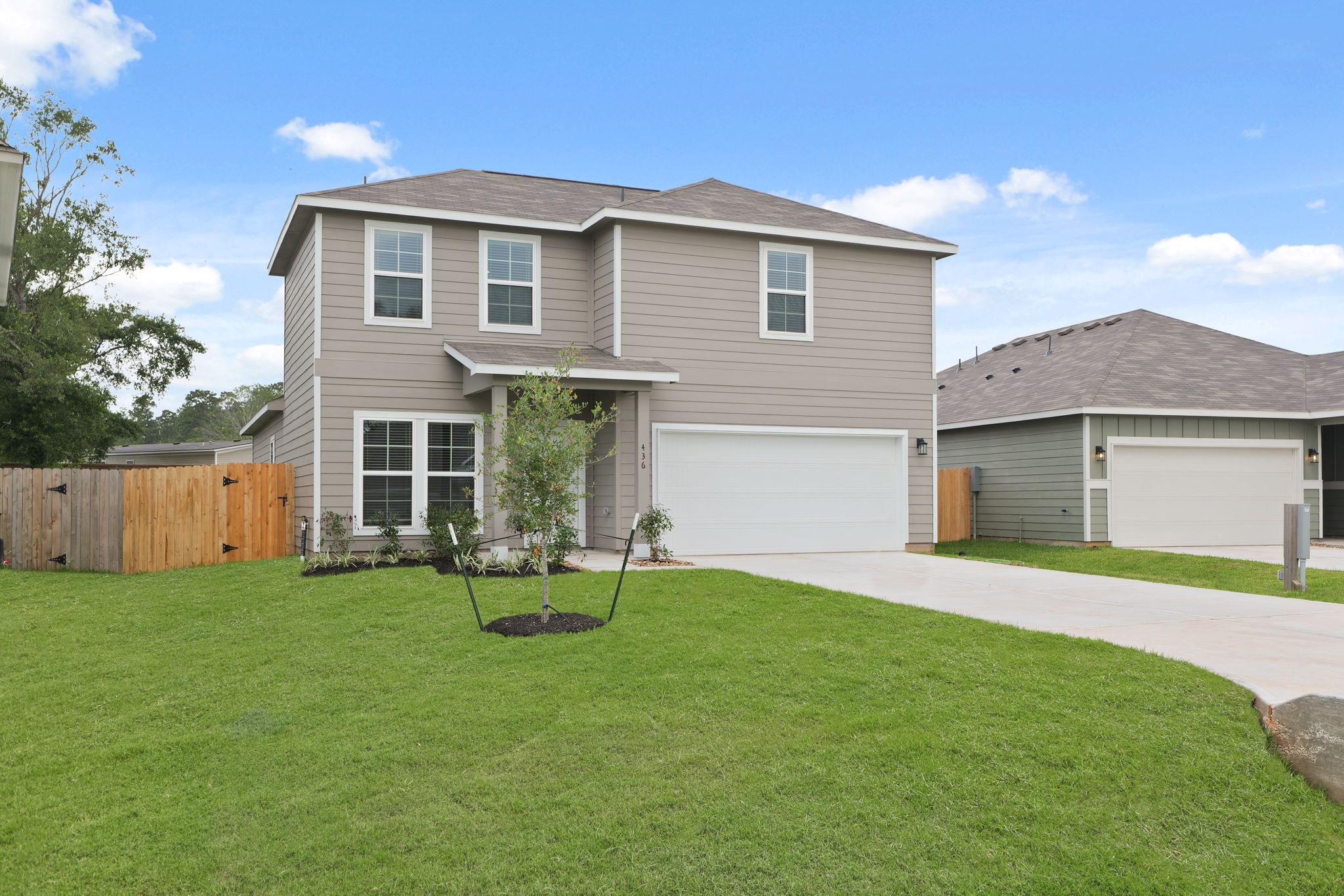 A house with a fence and a yard.