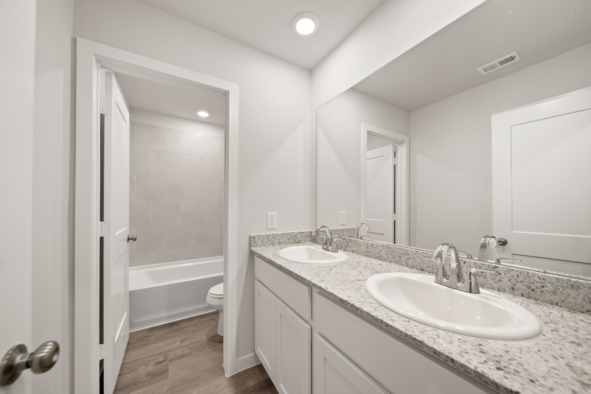 A bathroom with a sink and a tub.