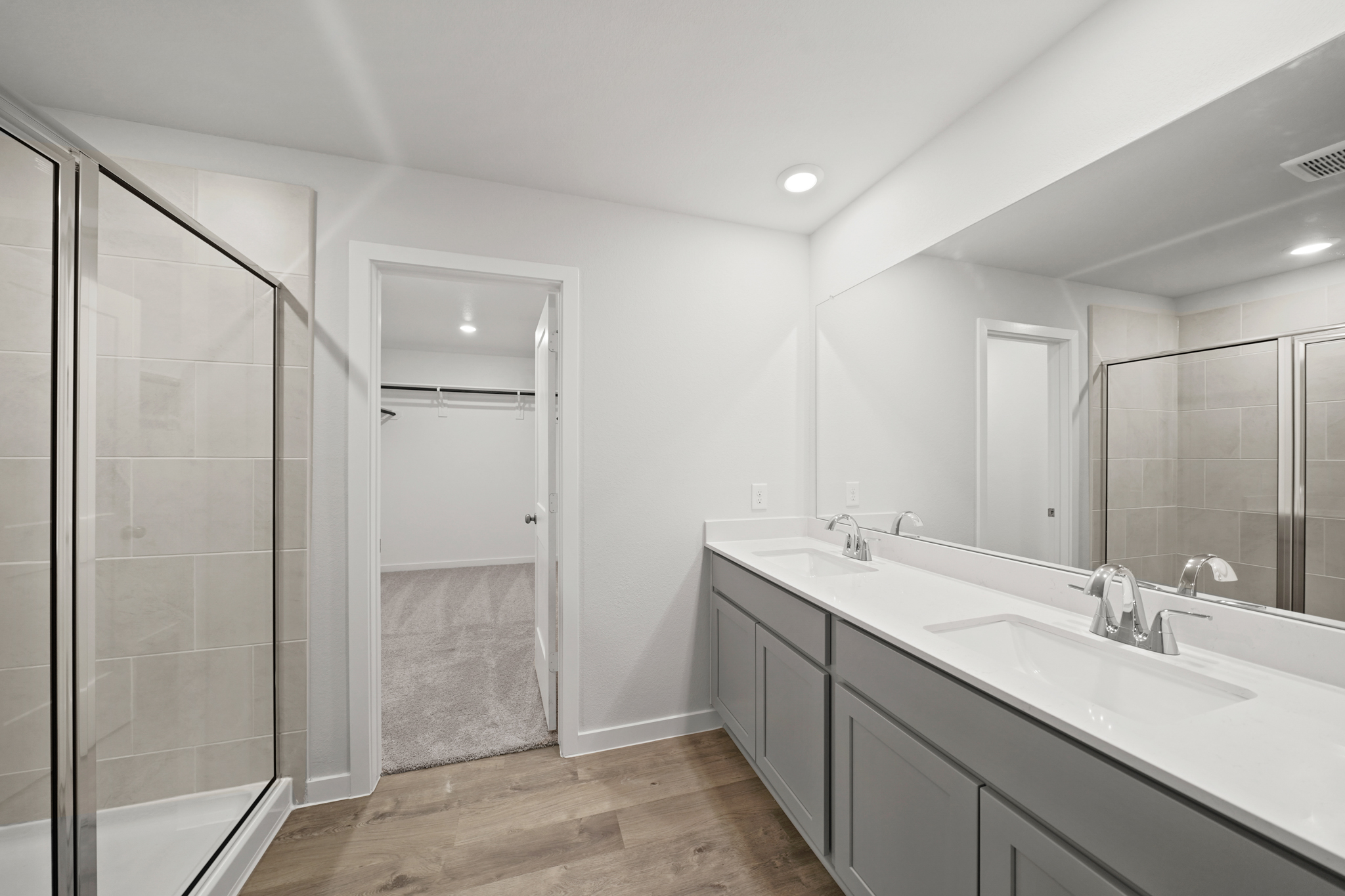 A bathroom with a glass shower.