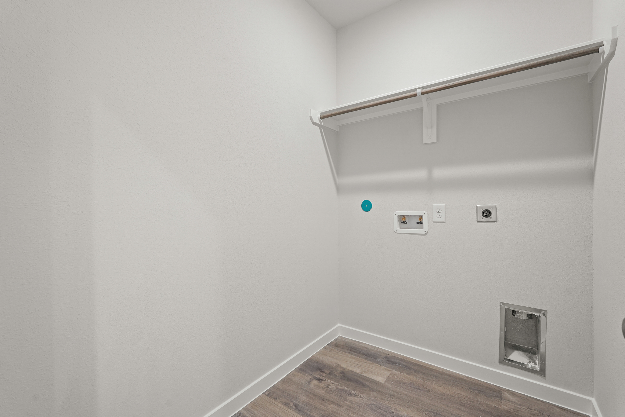 A white wall with a light on it.
