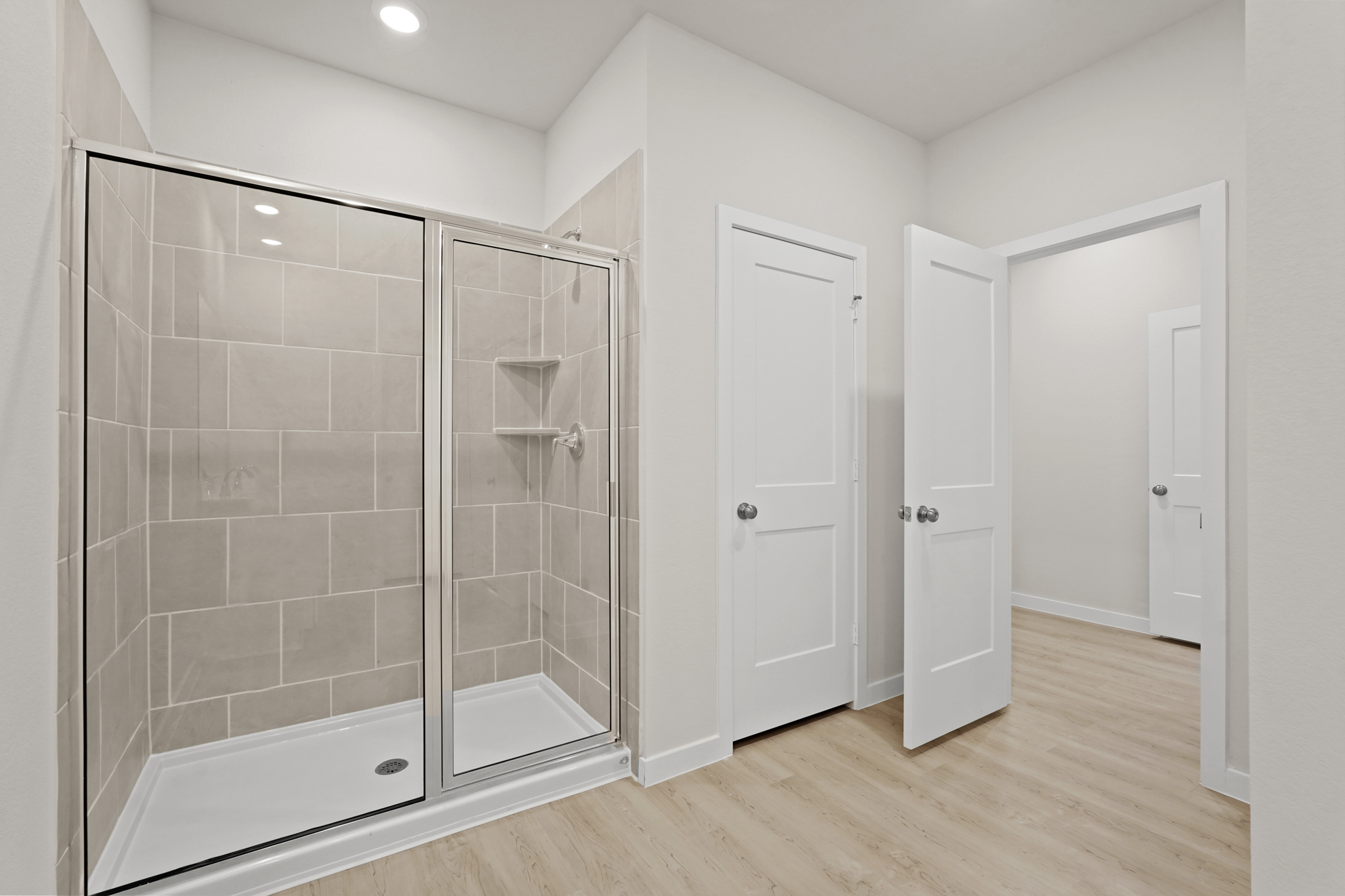 A bathroom with a glass shower.