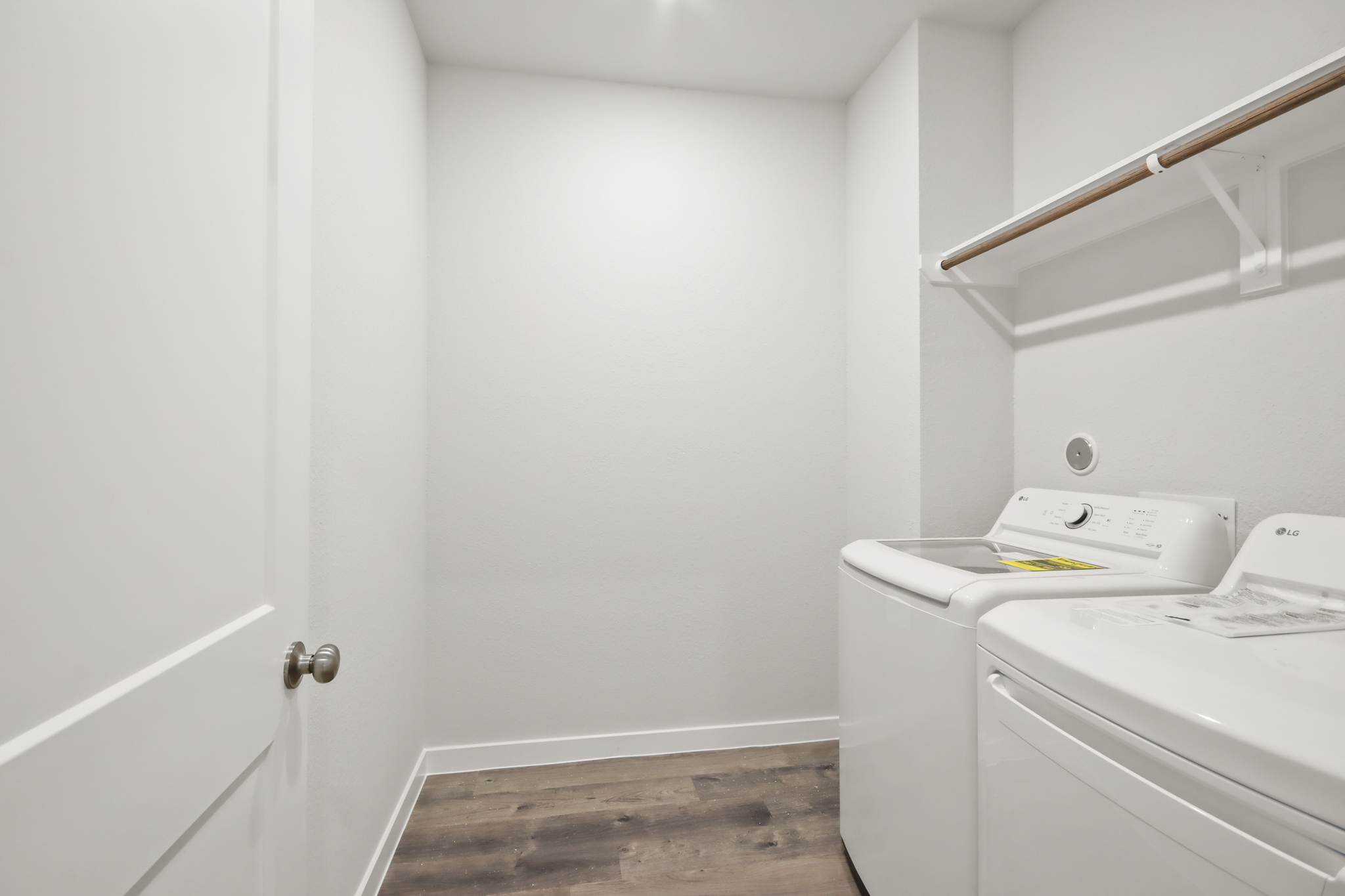 A room with a white door and a white counter with a white door.