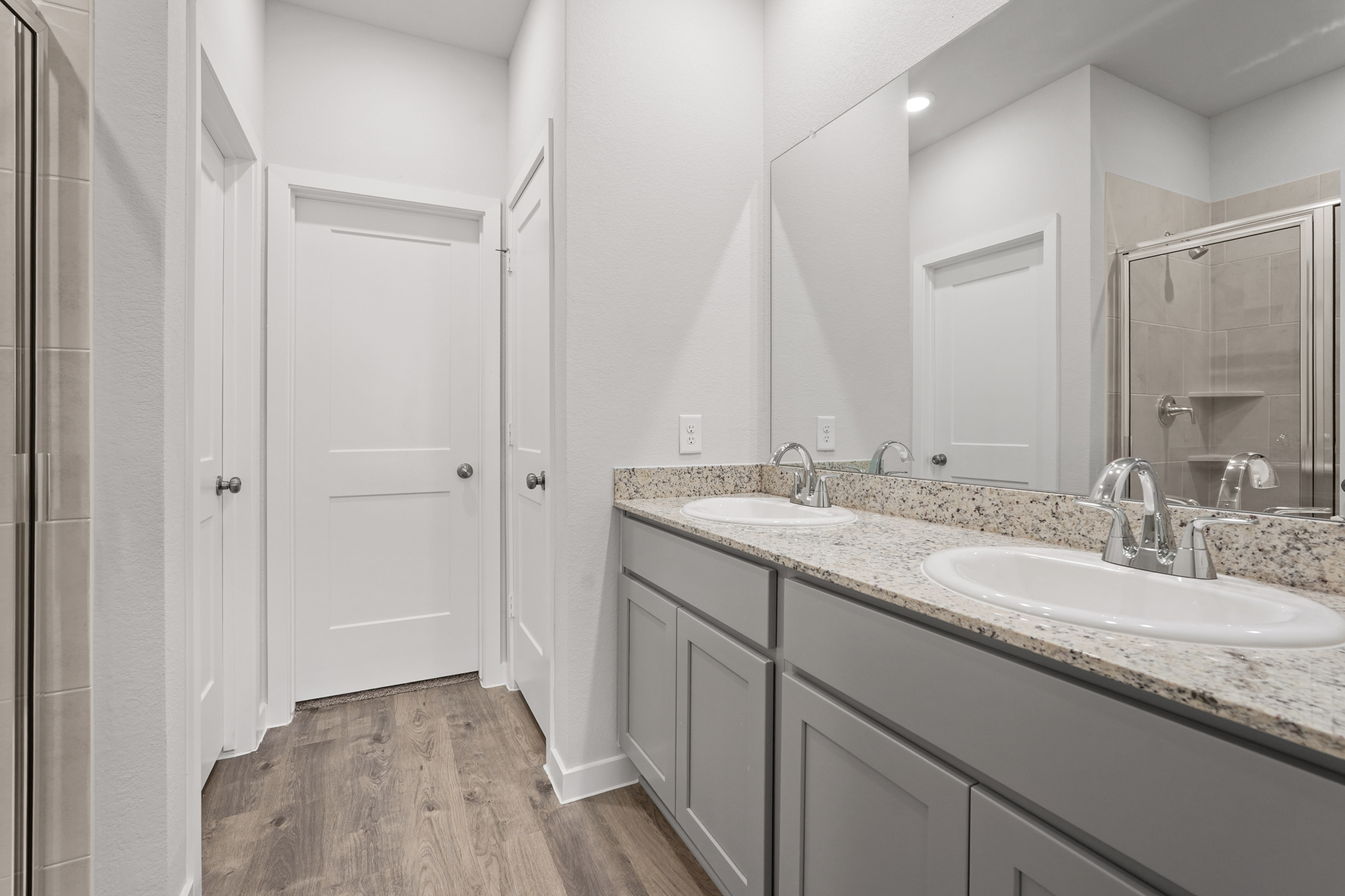 A bathroom with a marble countertop.