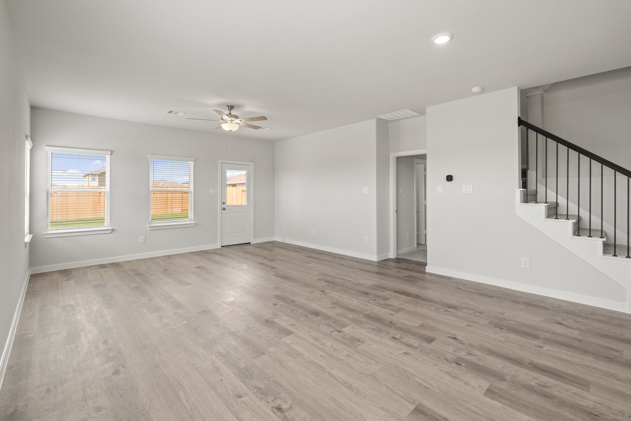 A room with a wood floor and a wood floor.