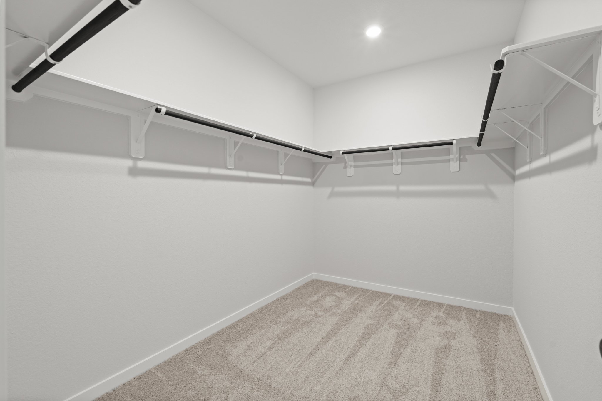 A white staircase with a light.