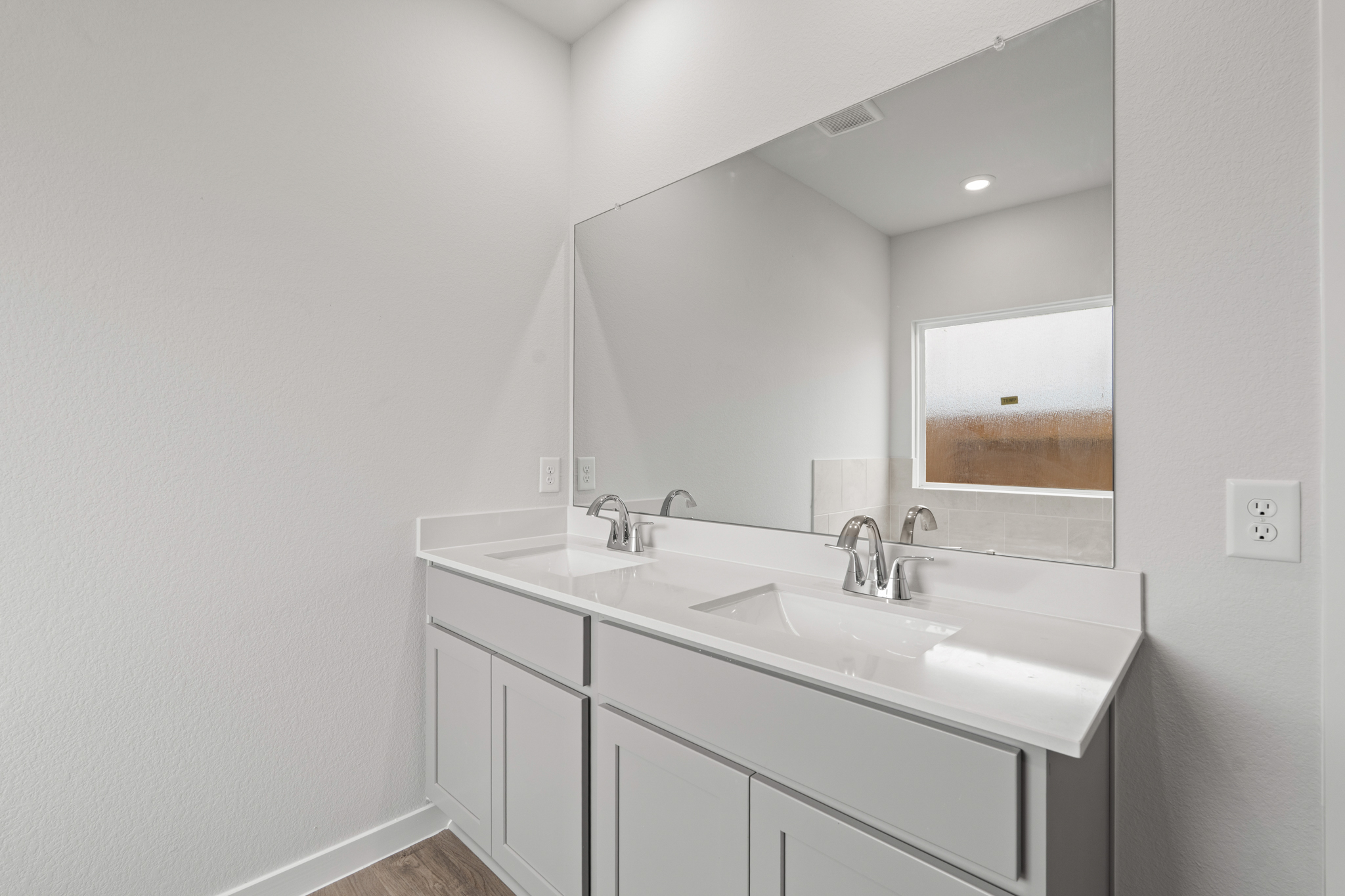 A bathroom with two sinks.