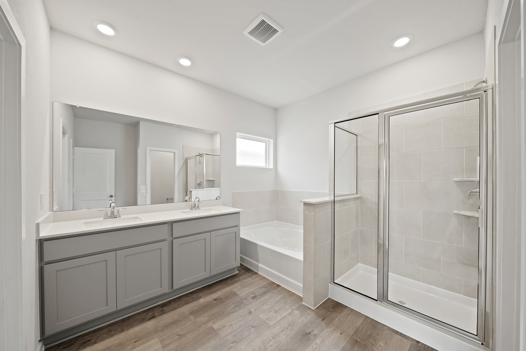 A bathroom with a glass shower.