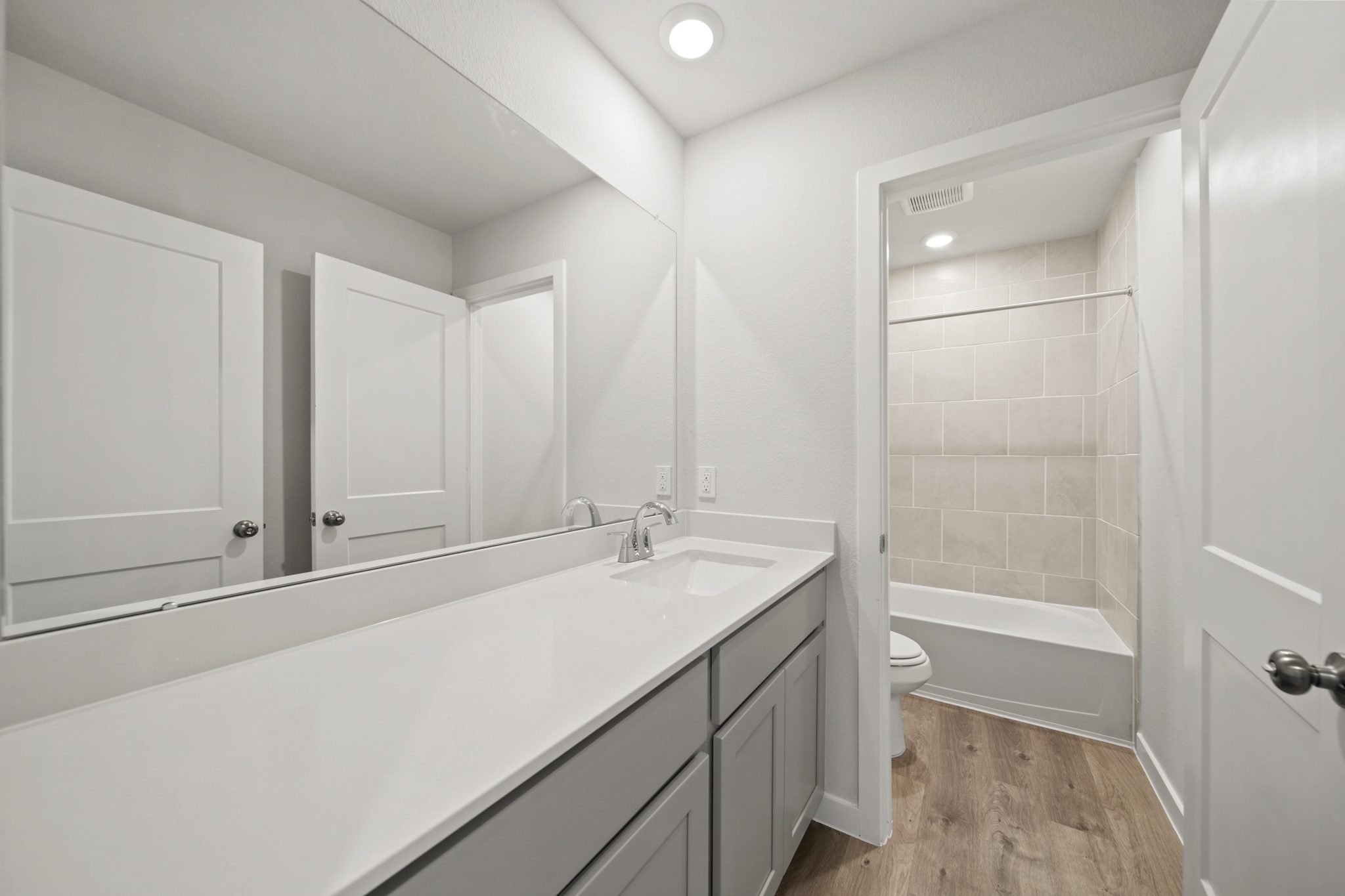 A bathroom with a tub and sink.