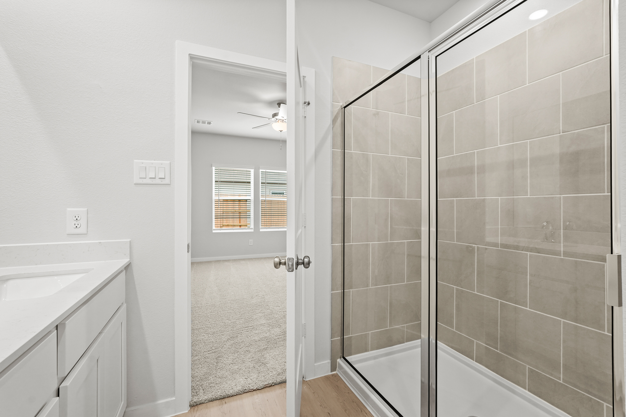 A bathroom with a glass shower.