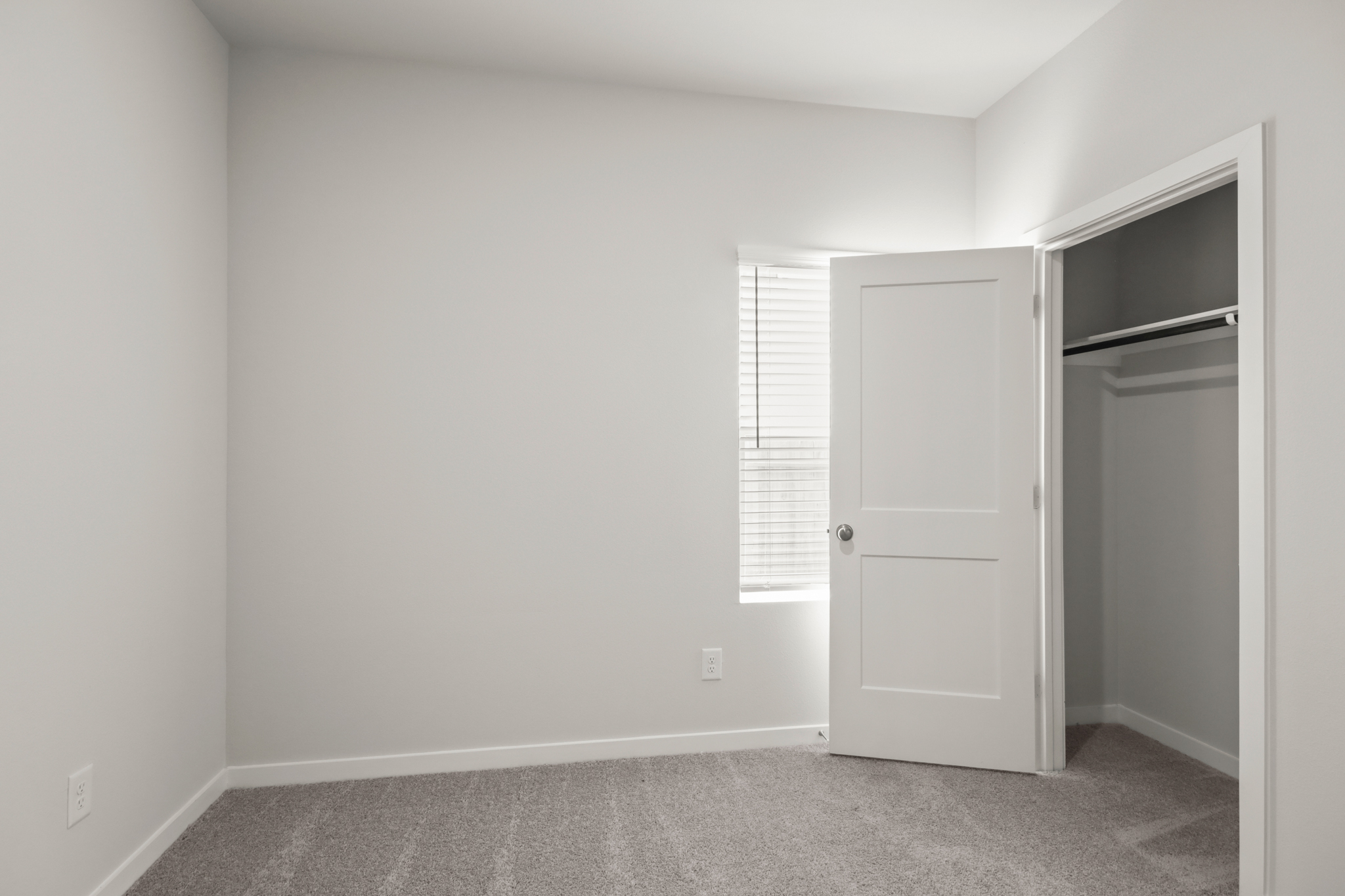 A room with a door and a window.