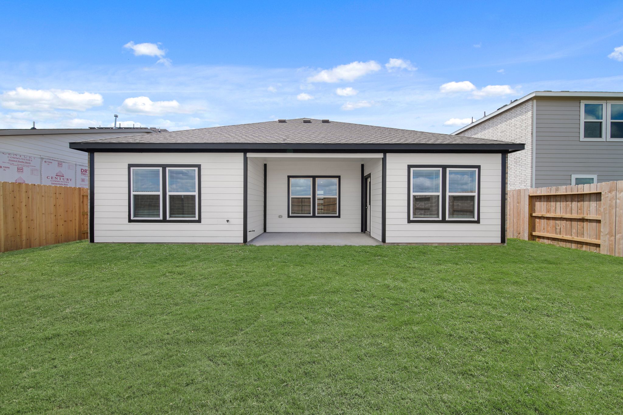A house with a grass yard.
