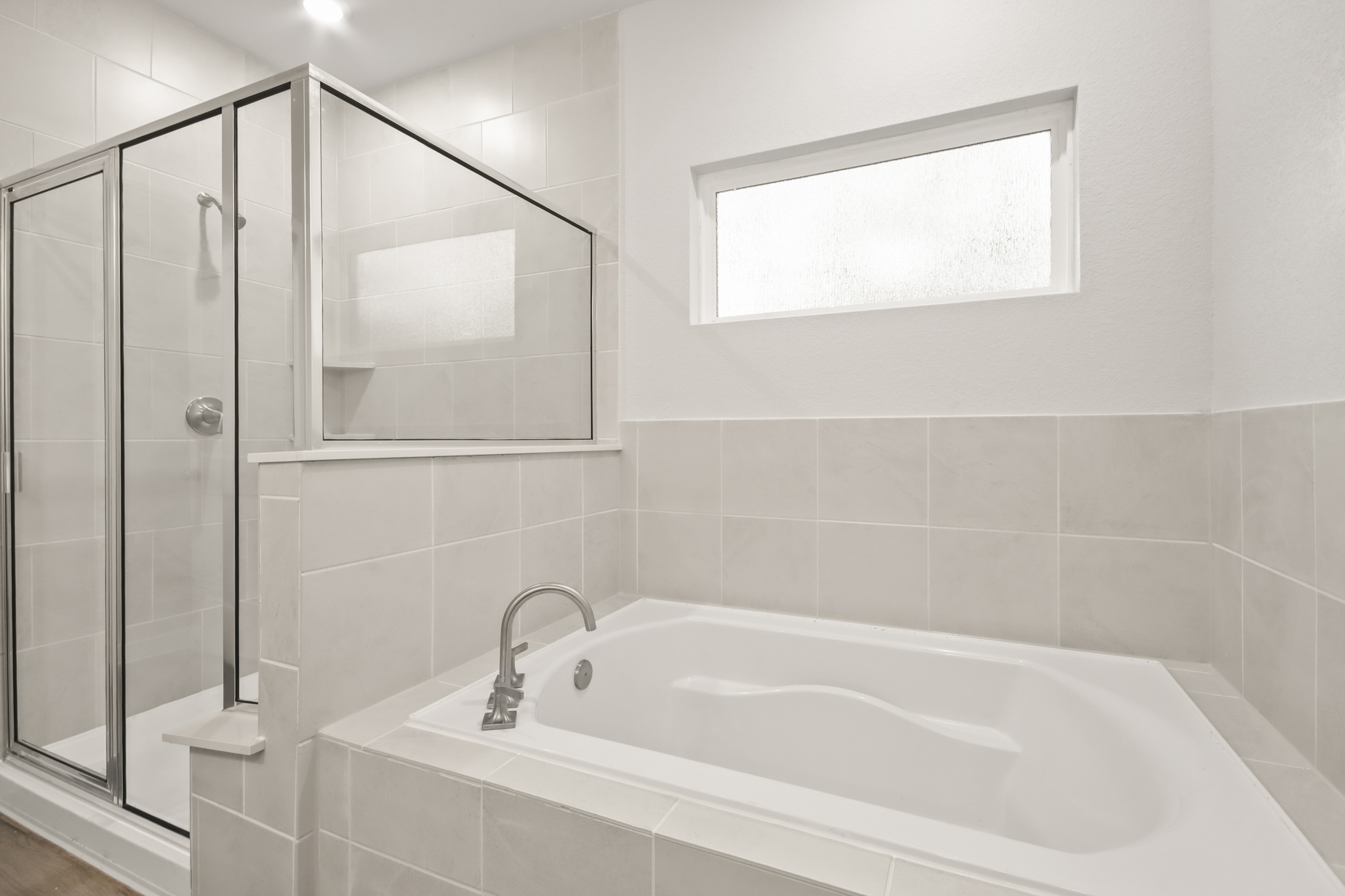 A bathroom with a glass shower.