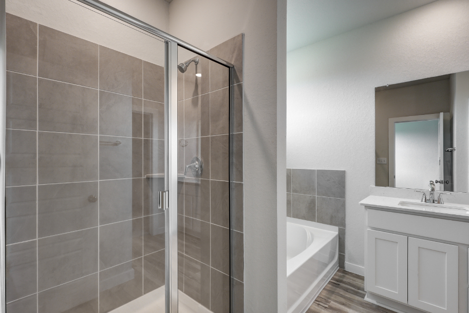 A bathroom with a glass shower.