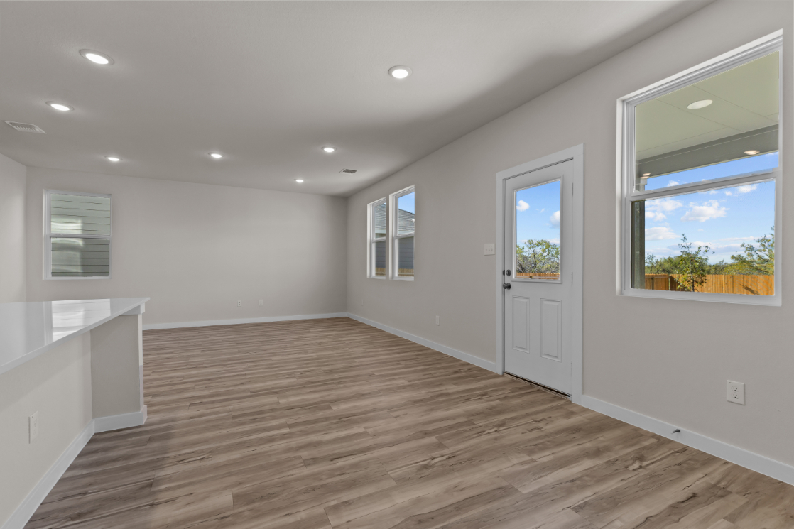 A room with white walls and windows.