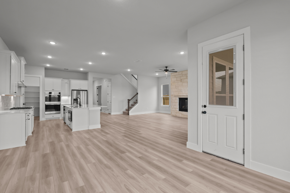 A large kitchen with white cabinets.