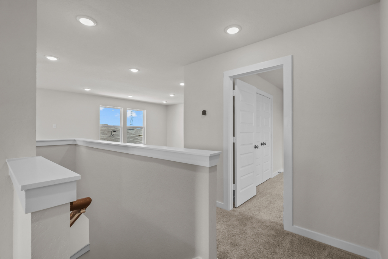 A bathroom with white walls.