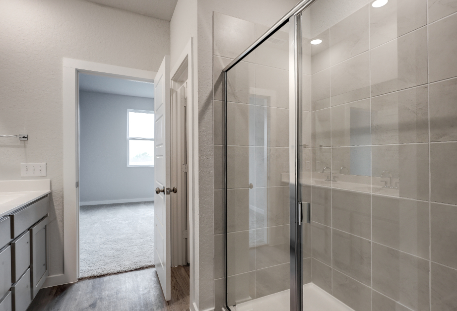 A shower with glass doors.