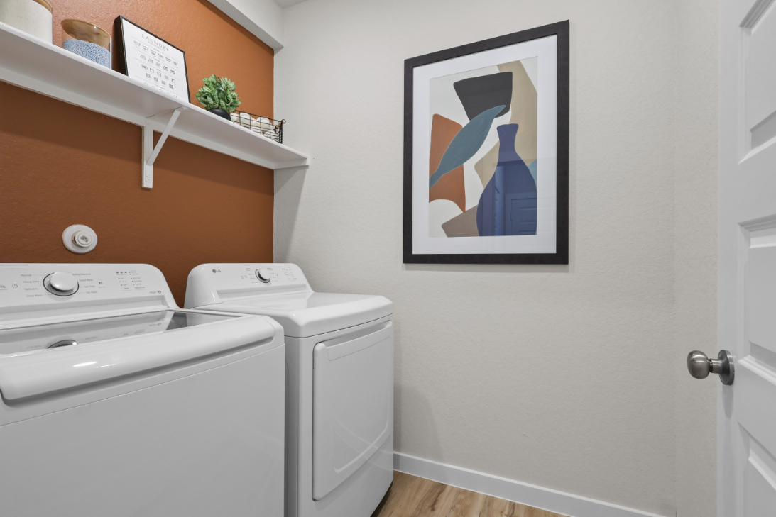 A white wall with a picture on it and a picture on the wall.