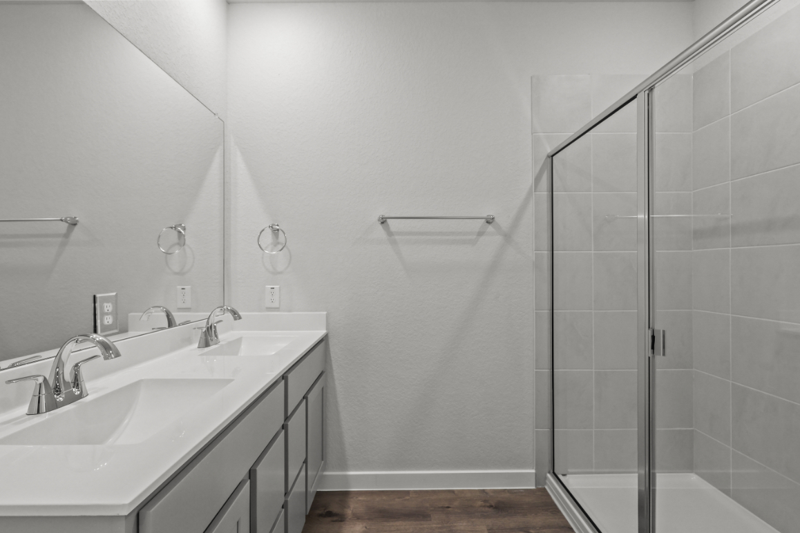 A bathroom with a glass shower.