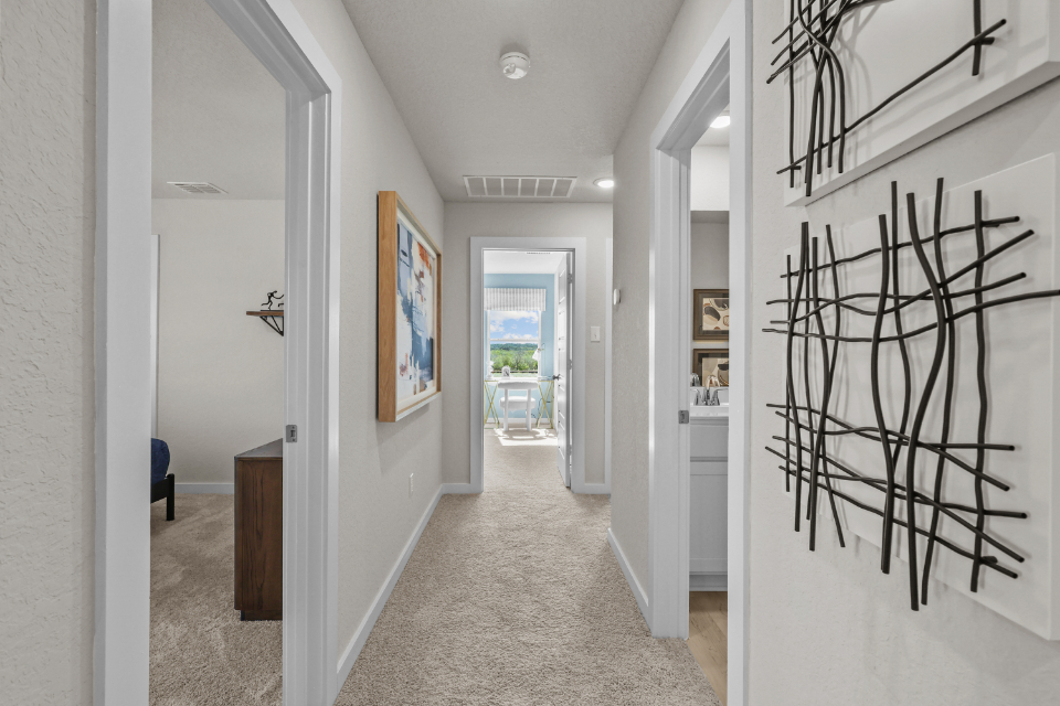 A hallway with white walls.