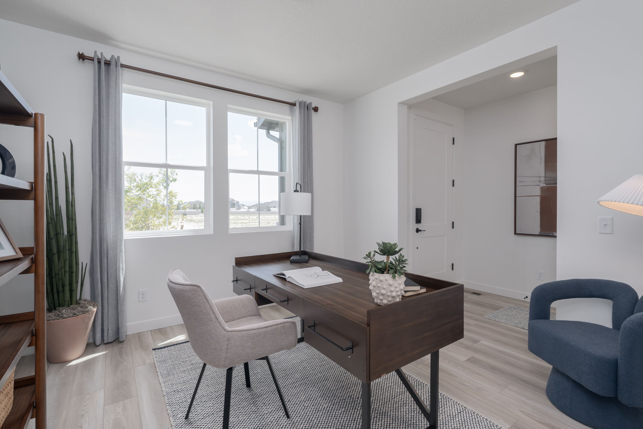 A room with a table and chairs.