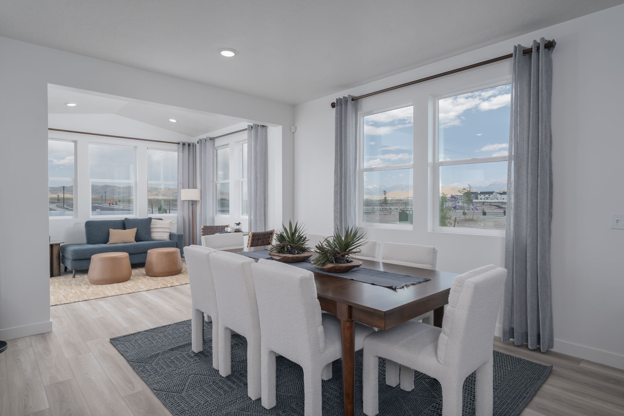 A dining room with a large window.