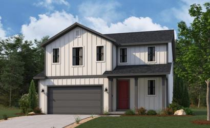 A white house with a garage.
