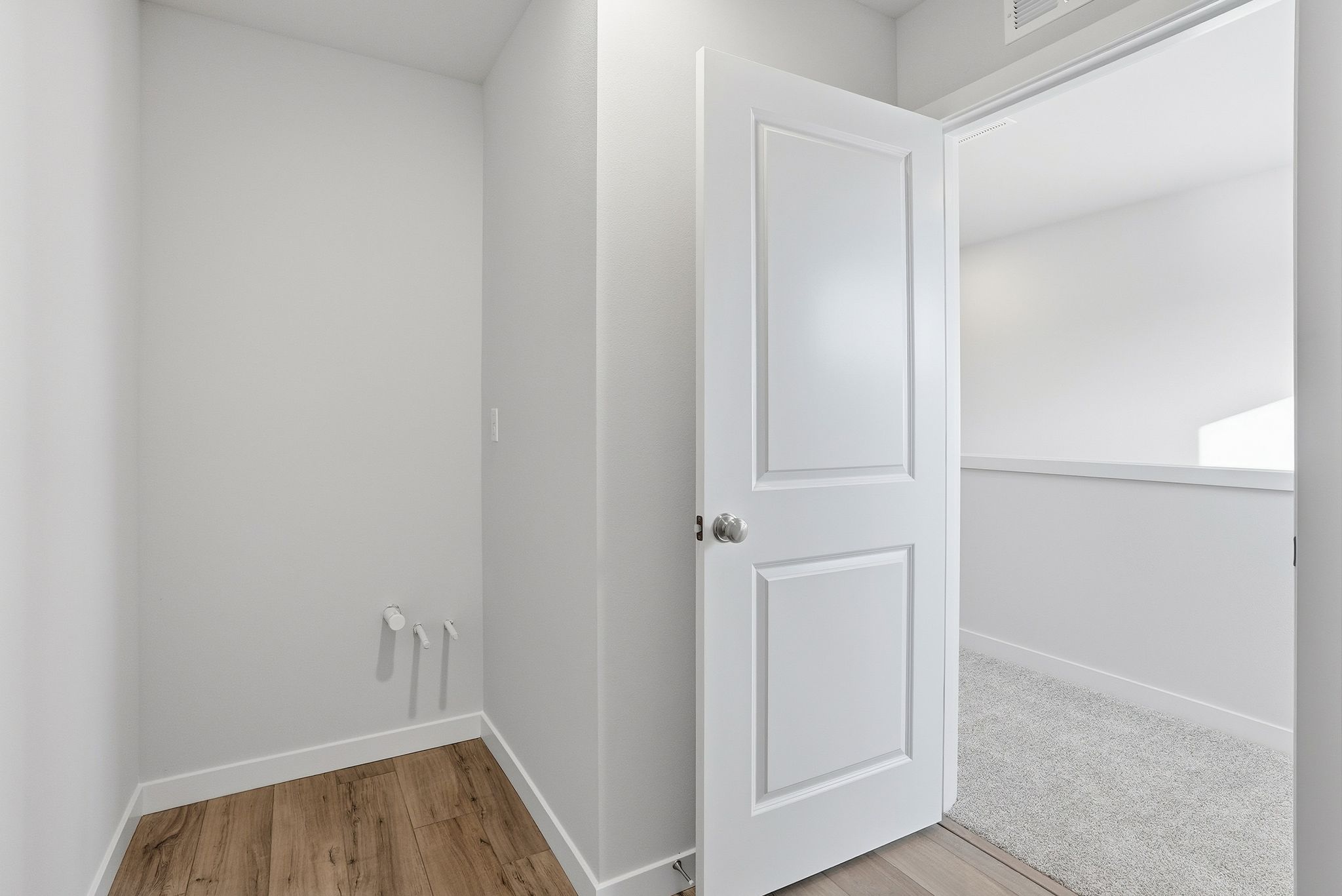 A white door in a room.