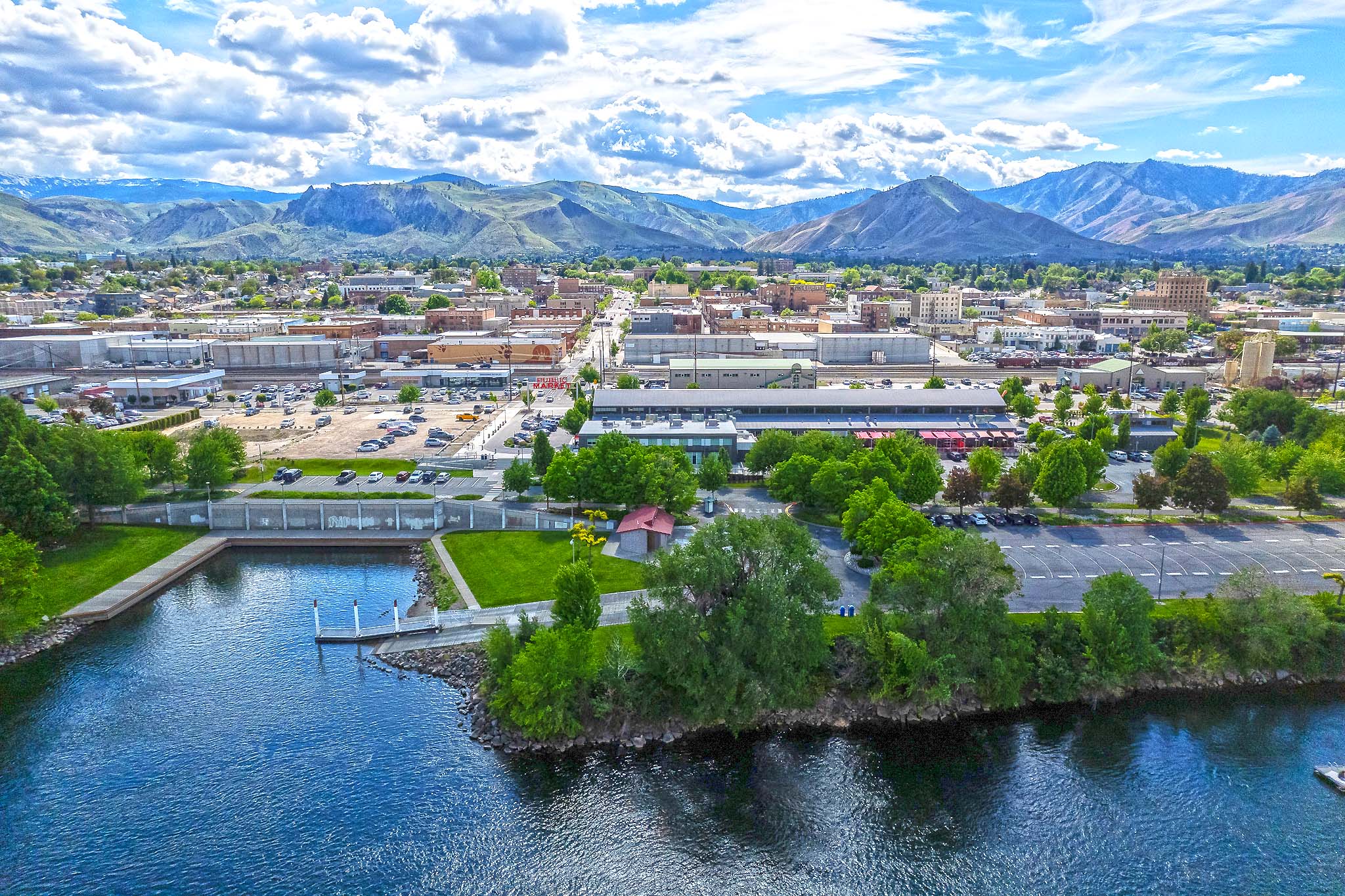 A river with a city in the background.