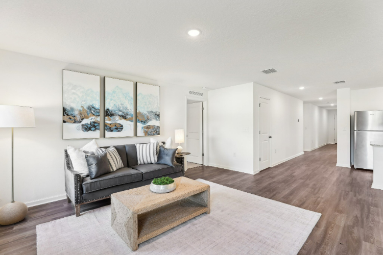 A living room with a couch and a coffee table.