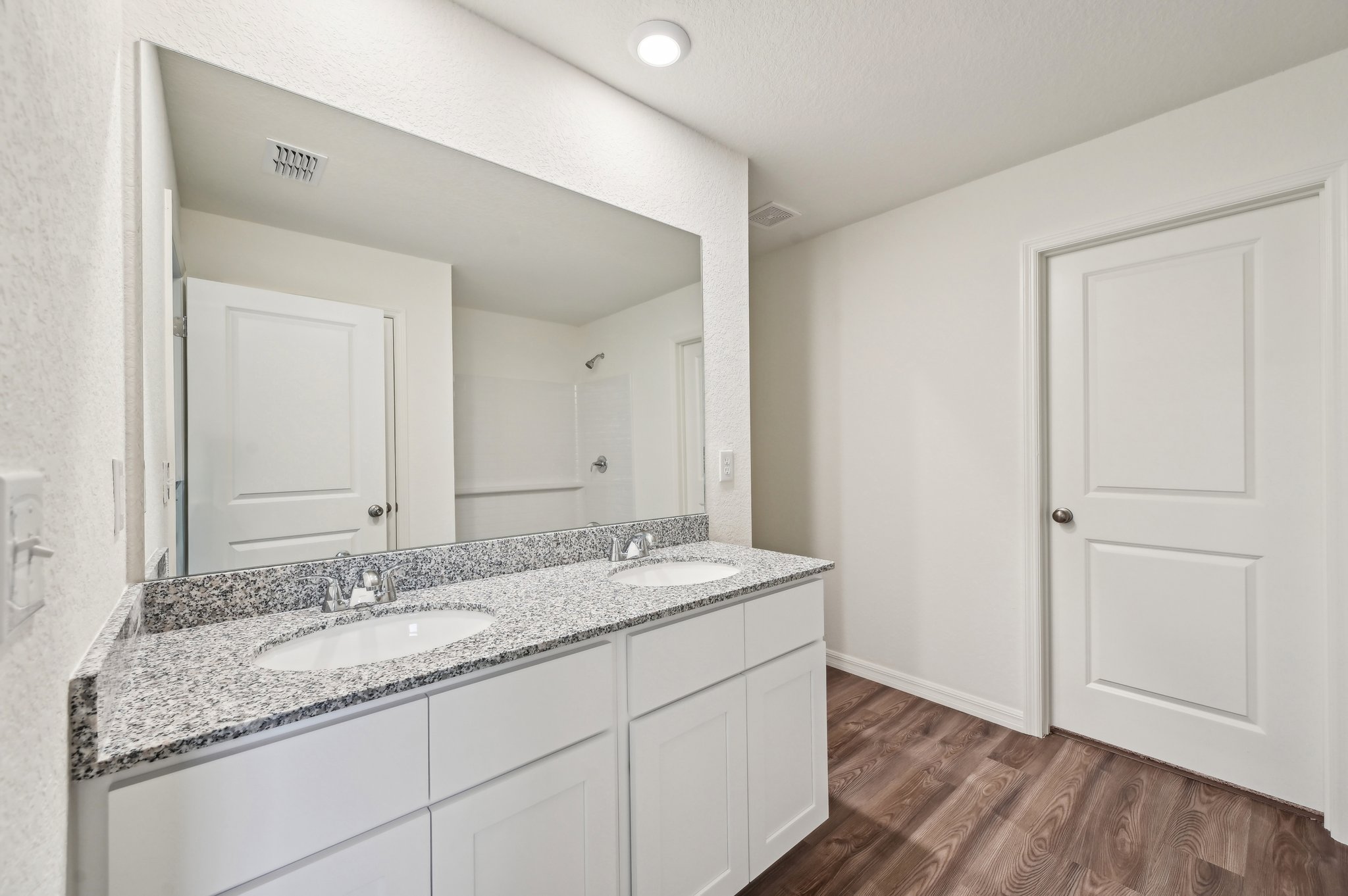A bathroom with a marble countertop.