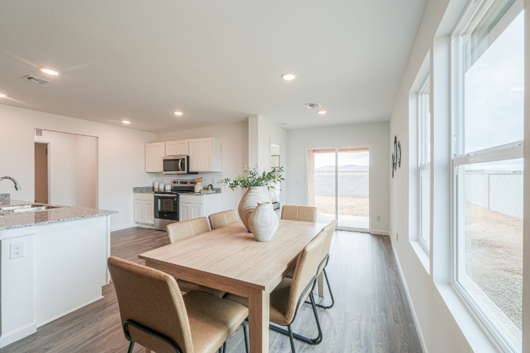A kitchen with a dining table.