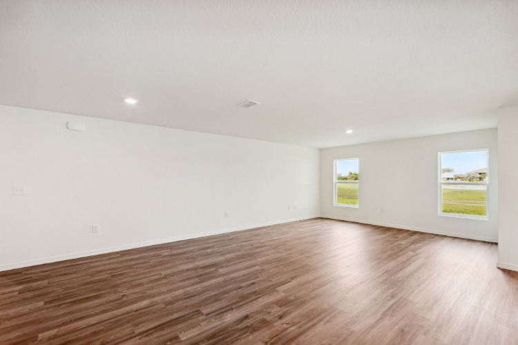 A room with a wood floor and a wood floor.