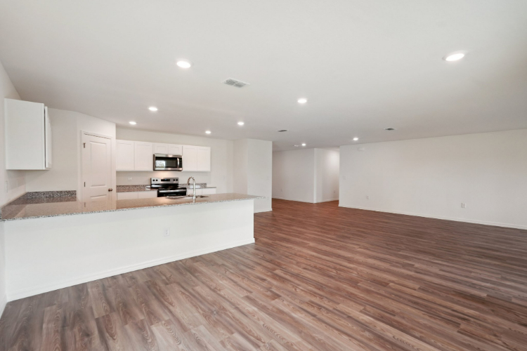 A large kitchen with white cabinets.