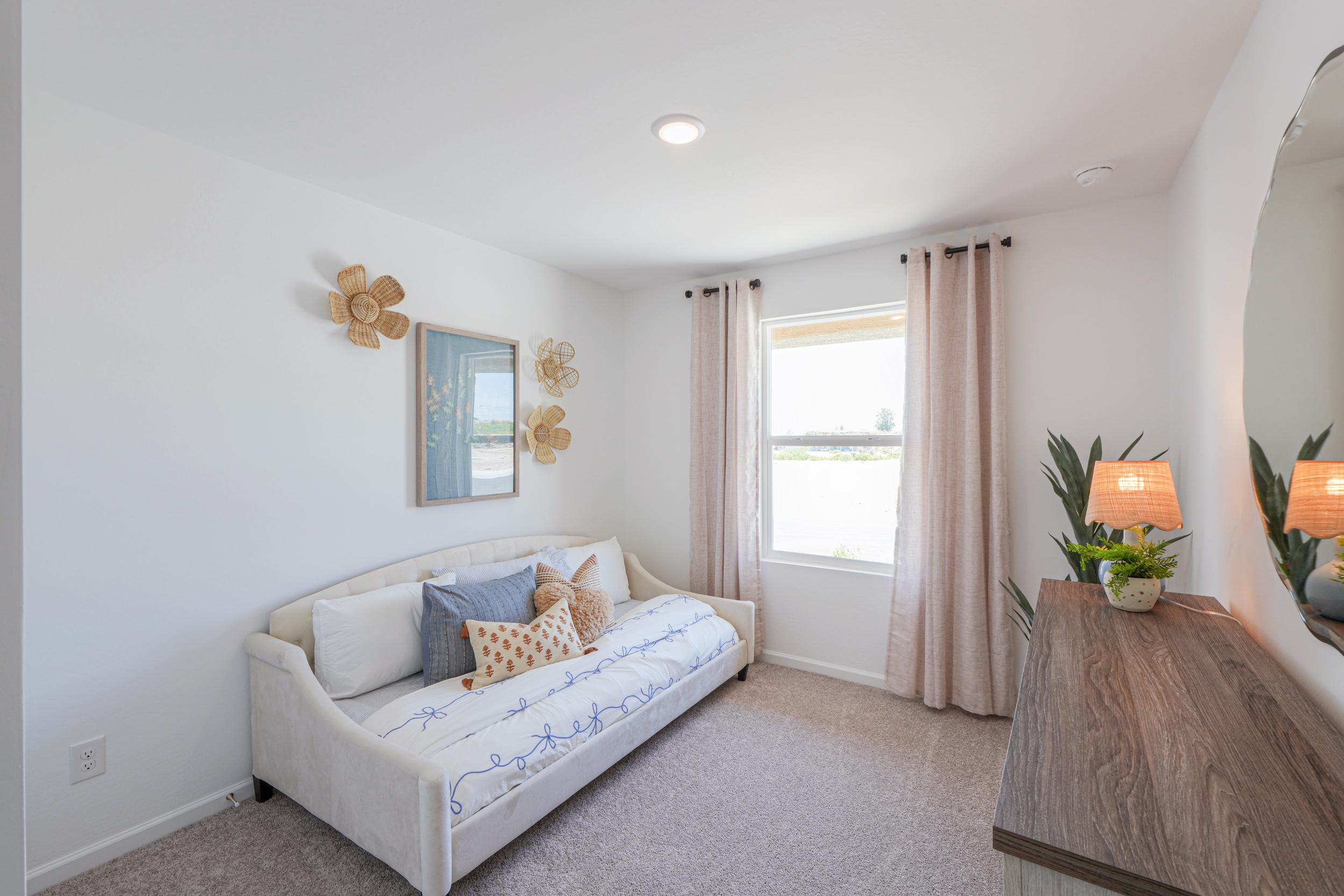 A living room with a white couch.