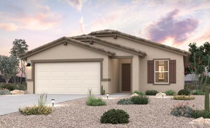 A house with a gravel driveway.