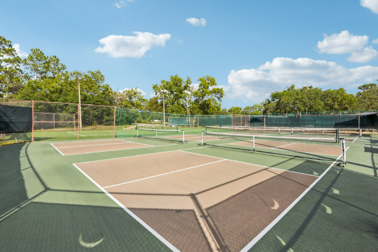 A tennis court with a net.
