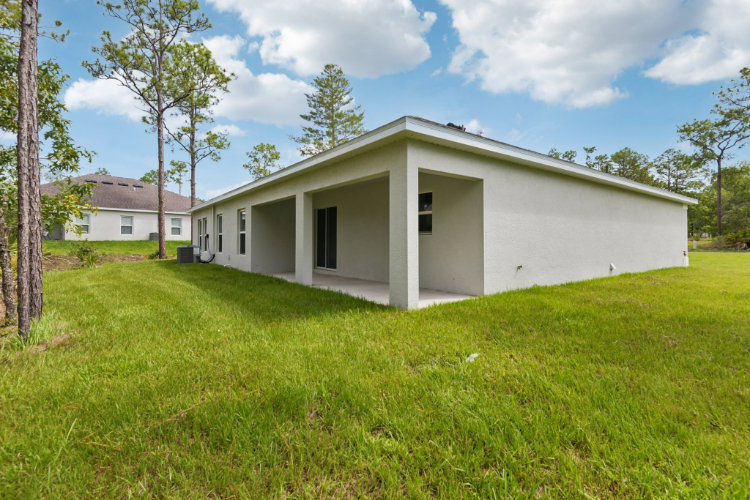 A white house with a garage.