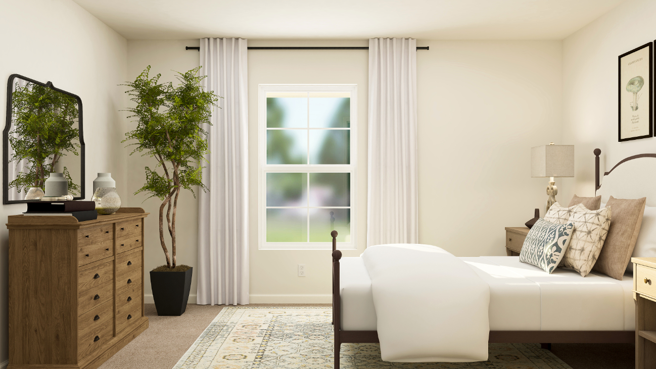 A living room with a white couch and a white chair.